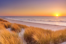 huisduinen strand sonnenuntergang