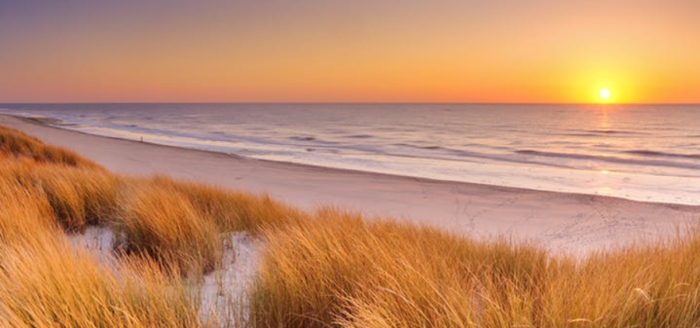 huisduinen strand sonnenuntergang